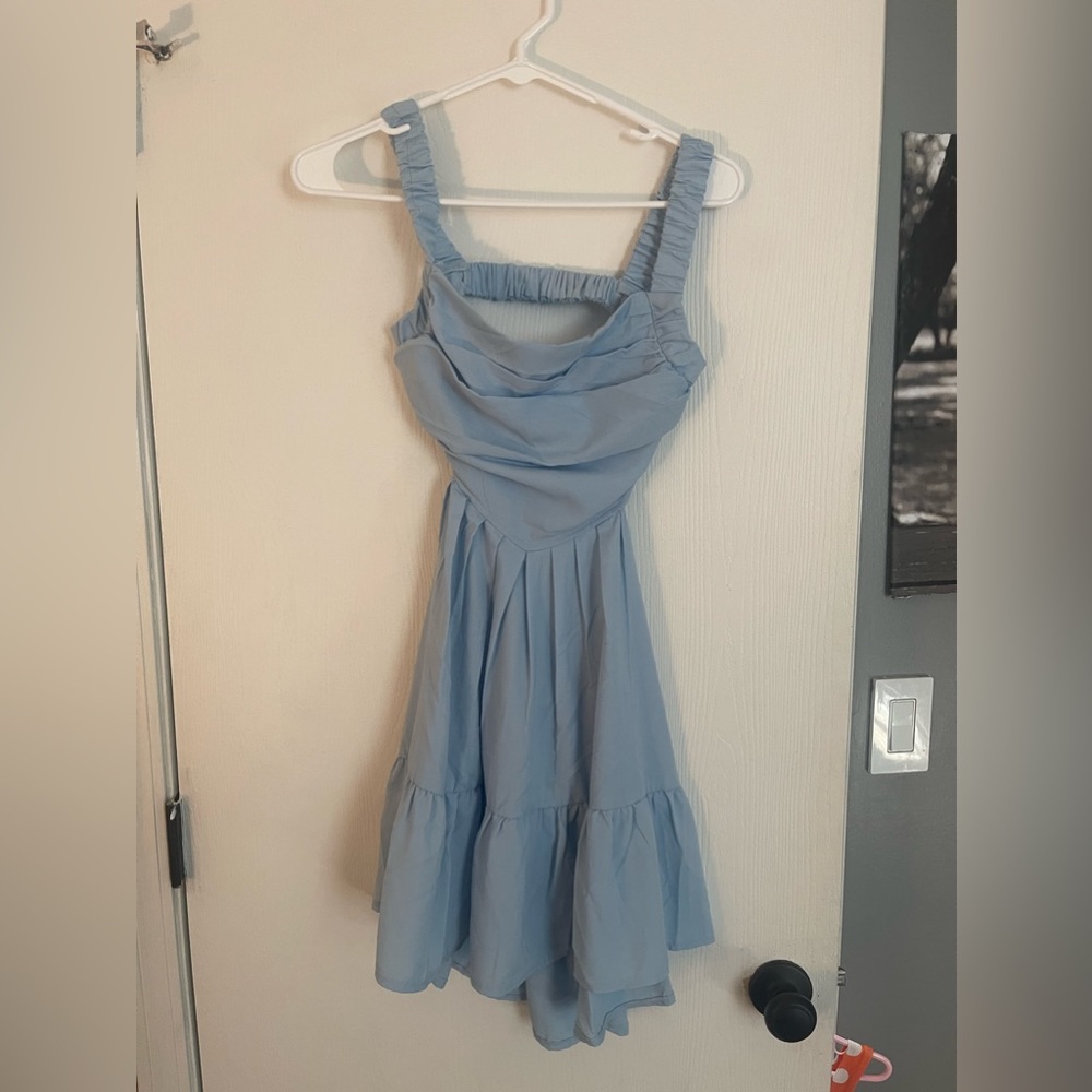 Never worn small blue backless and missing sides dress